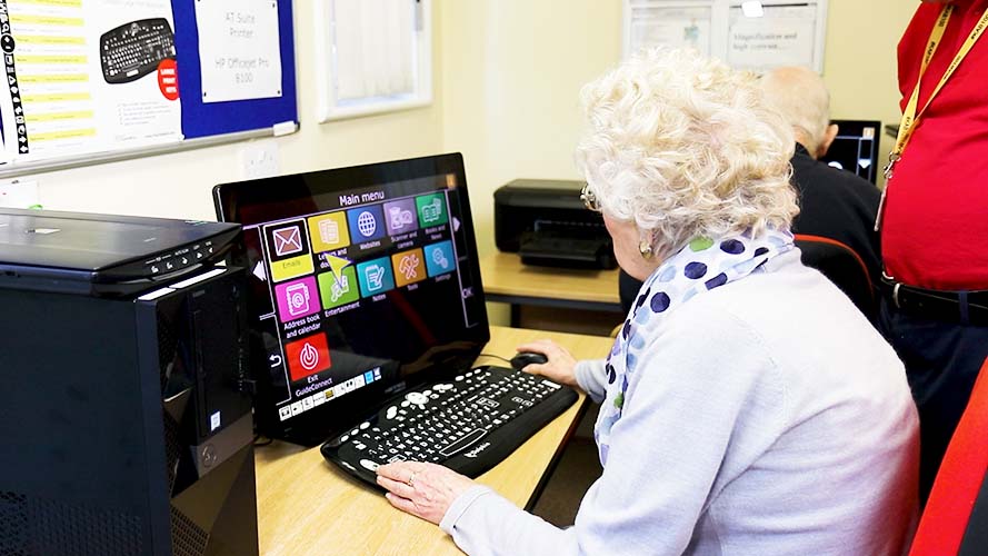 A Senior woman to using GuideConnect on a PC.